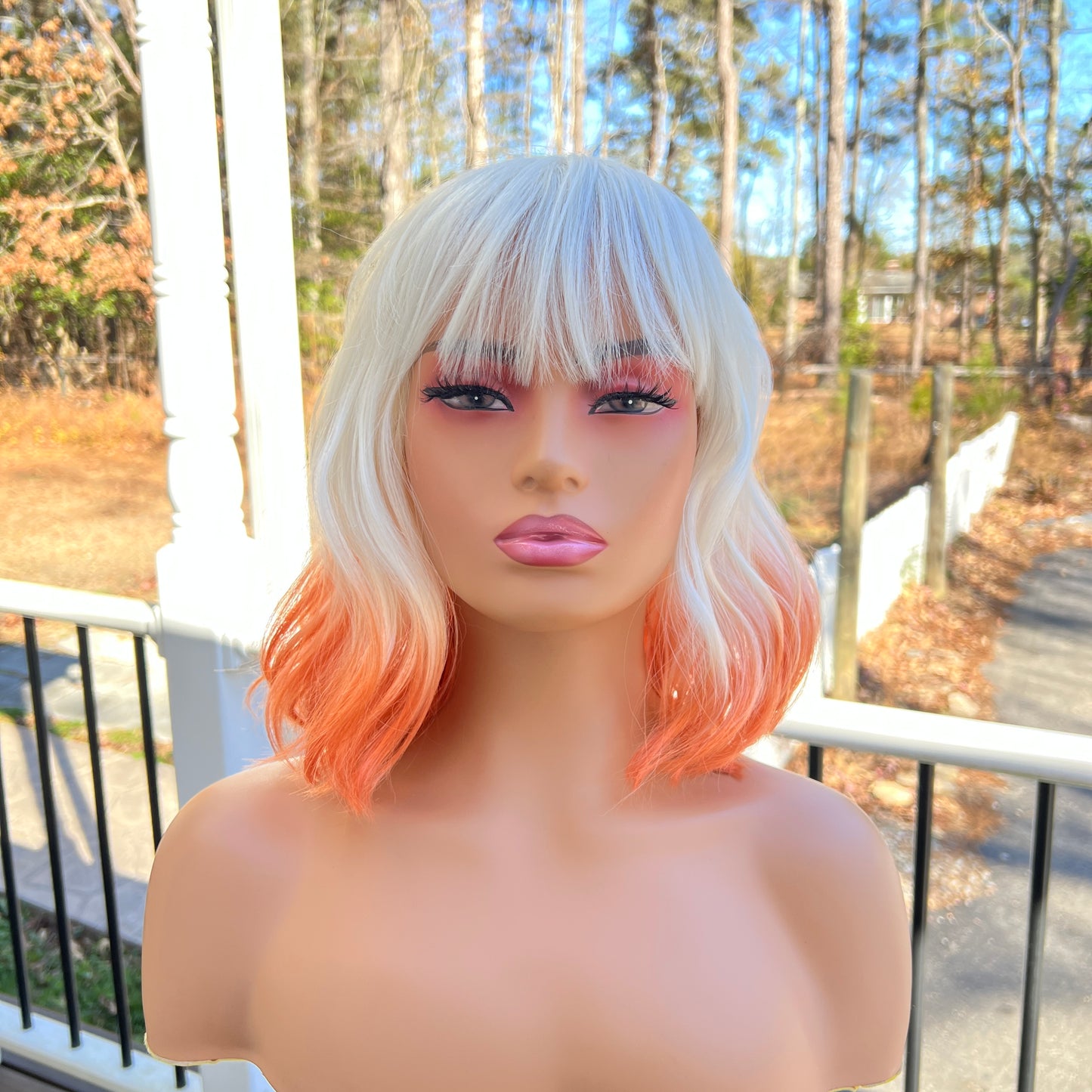 CREME SODA - Platinum White and Orange synthetic wig with bangs