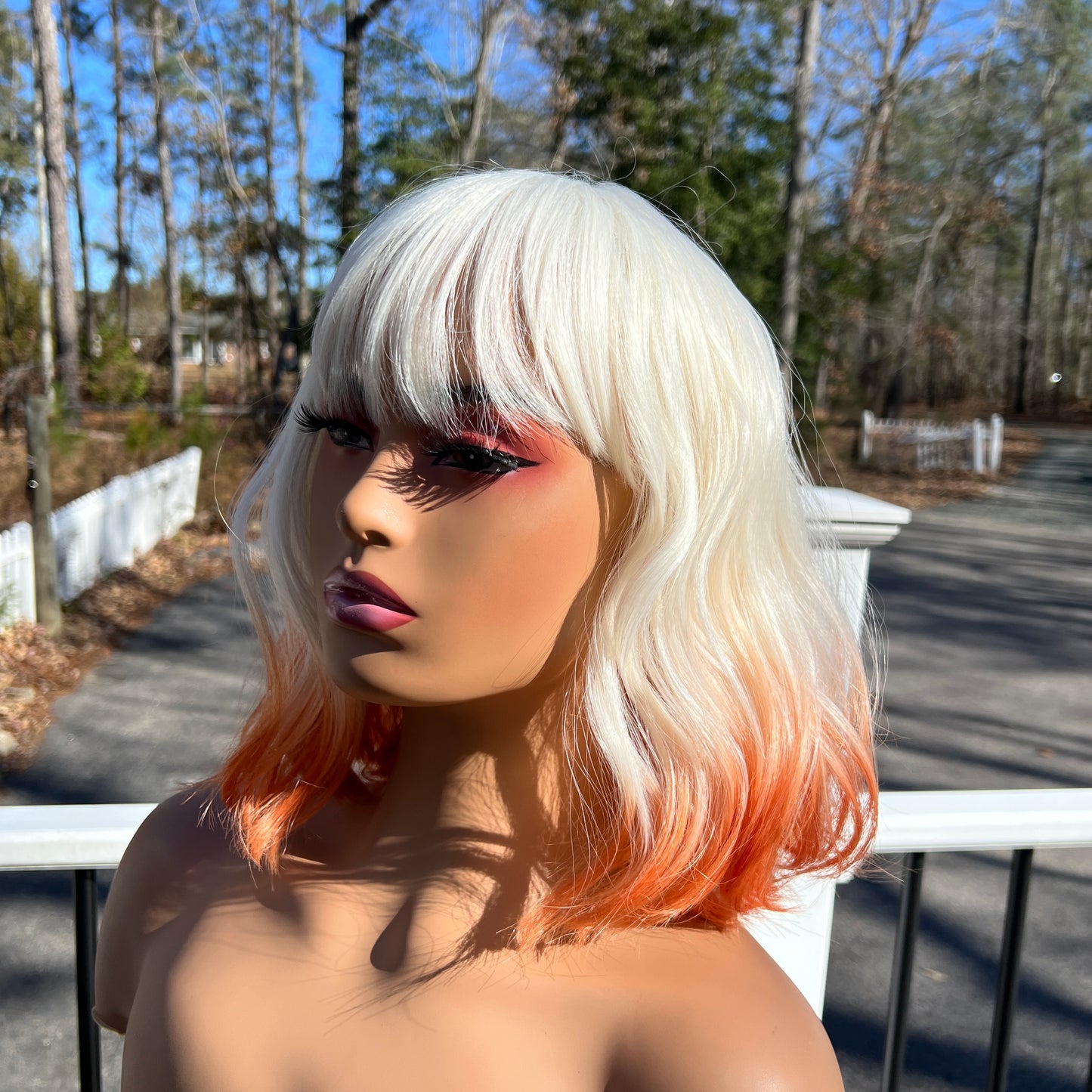 CREME SODA - Platinum White and Orange synthetic wig with bangs